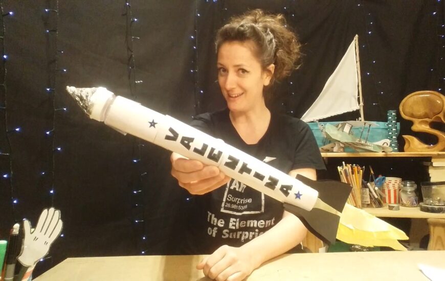Artist Jenny Lockyer holding a rocket